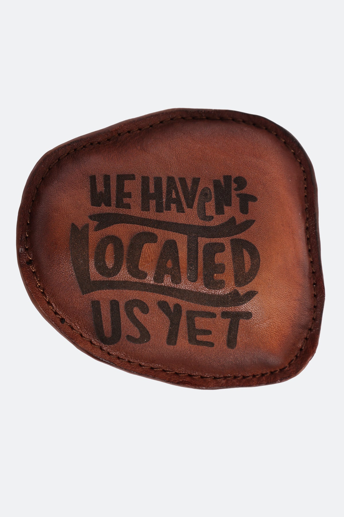 40/41 “We Haven’t Located Us Yet” Leather Paperweight (Limited Edition)